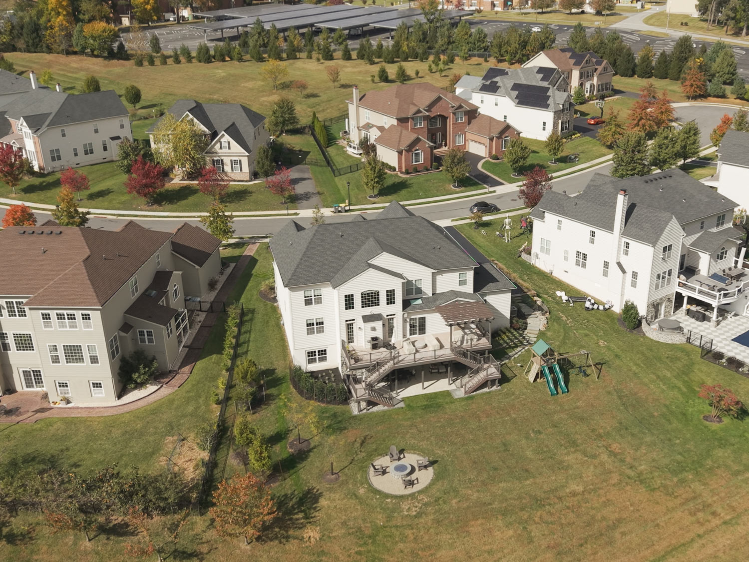 Aerial photo showing residential homes and surrounding neighborhood layout from above