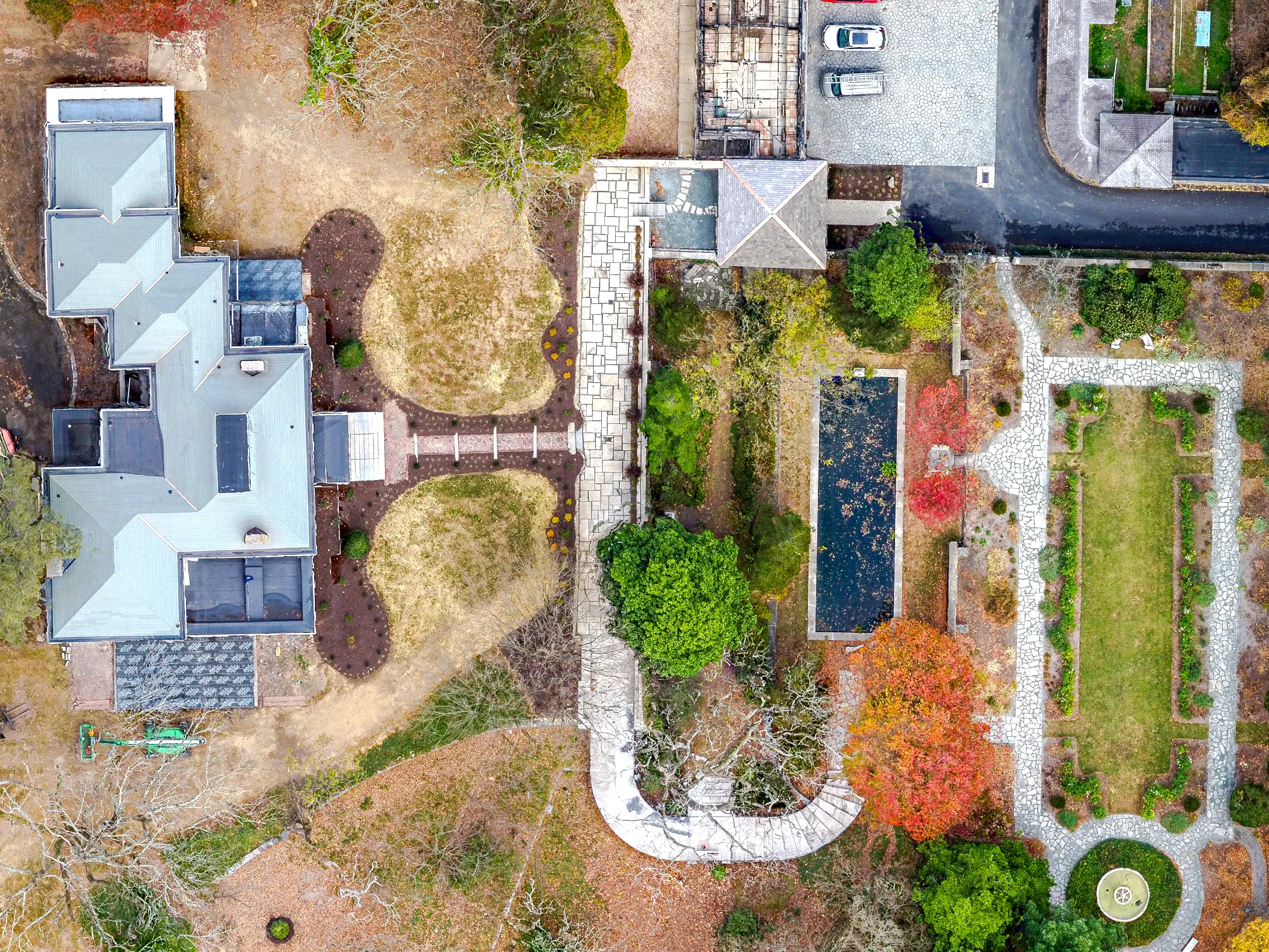 Straight-down aerial view of Gibraltar Estate in Wilmington, Delaware showing the full marble promenade axis, reflecting pool, formal garden parterres, and outbuildings following historic restoration by Eastern Horticultural Services
